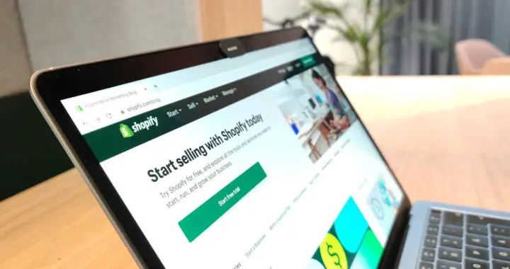 An image of a laptop showing a webpage from Shopify website for the article "Advantages and Disadvantages of Shopify"