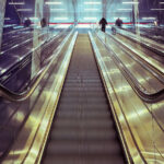 An image of an escalator for the article "Bottom-Up Management: Advantages and Disadvantages"