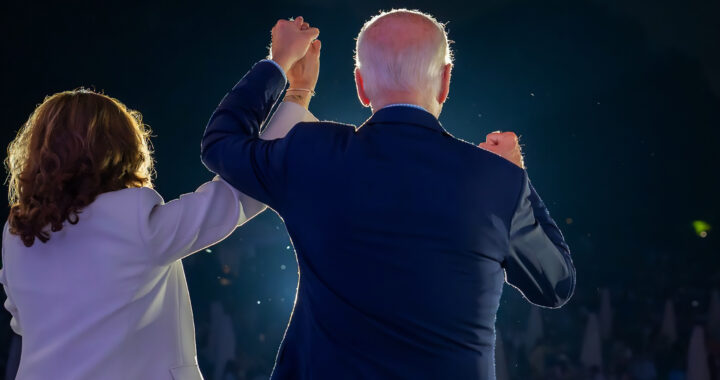 A backshot of Kamala Harris and Joe Biden facing the crowd for the article "The Economic Accomplishments of the Biden Administration"